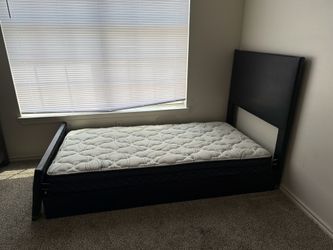 Twin bed with a mattress