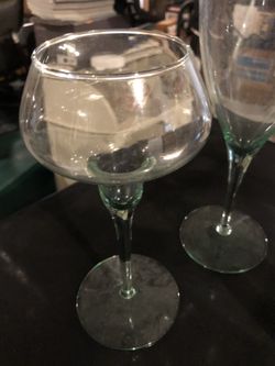 Water pitcher, 4glasses, 2 candle holders. All light green glass