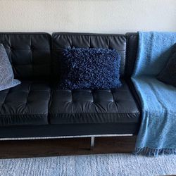 Black Leather Couch In Need Of Light Repairs