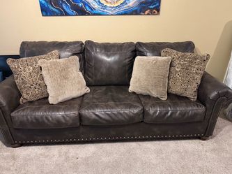 Brand new leather couches from Rooms To Go