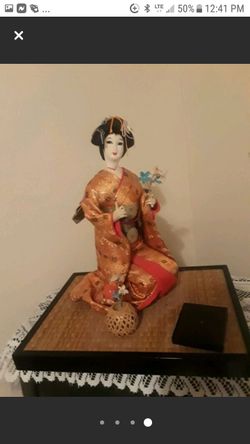 Japanese Geisha doll kneeling