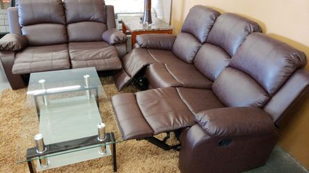 Brown leather reclining sofa and loveseat
