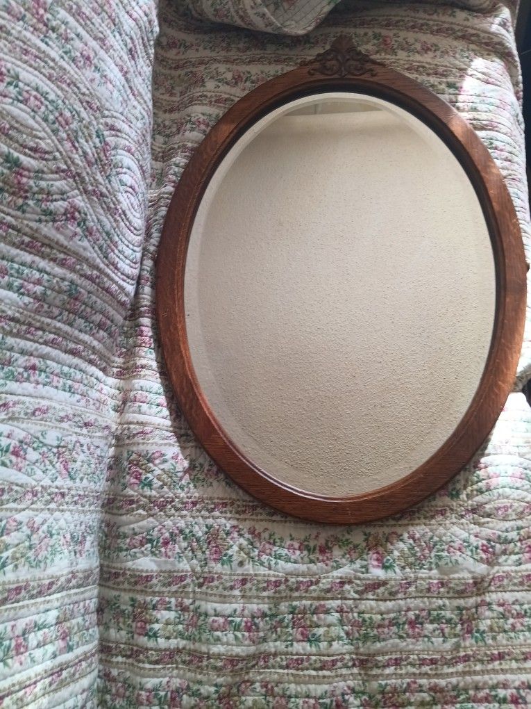 ANTIQUE OAK OVAL BEVELED GLASS
