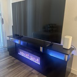 Keely 70'' TV Stand for TVs up to 80'' with Electric Fireplace and Adjustable Shelves