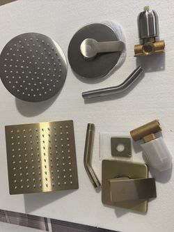 Shower sets with valve. Both new in box . We have brushed nickel round shape /gold finish square