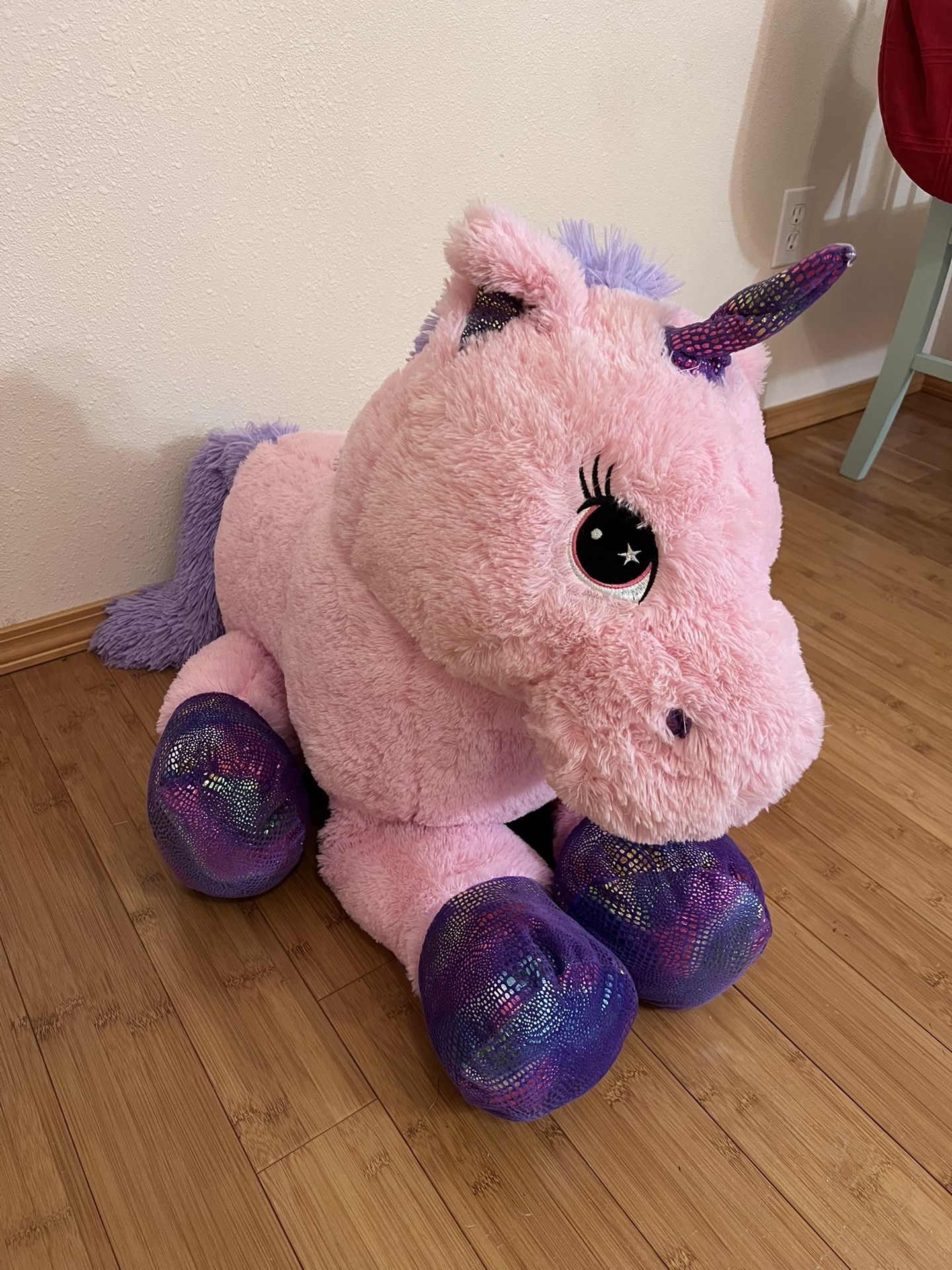 Giant pink and purple stuffed unicorn plush