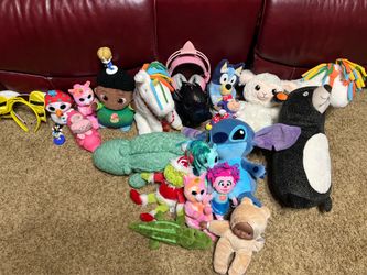 Bunch of stuffed animals and a couple of toys