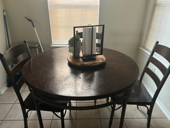 Table and three chairs