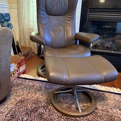 Wing Ekornes Stressless recliner with signature base, medium size, in brown Paloma leather.  