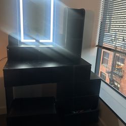 Vanity table with mirror and a seat 