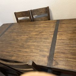 Ashley dining table with 4 chairs,, and 2 free leather chairs