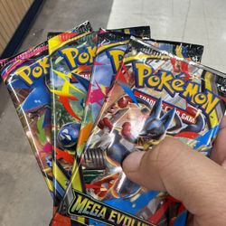 Pokémon (3 phantasmal flames booster packs) and (1 Mega Evolution booster pack) 
