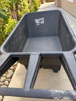 Rubbermaid Black Plastic Wheelbarrow & Wooden Lumber Posts and Boards