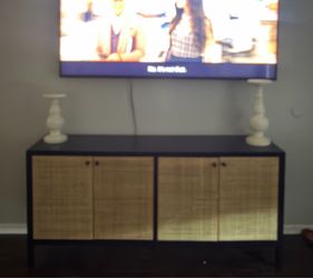 60 in tan and black TV stand