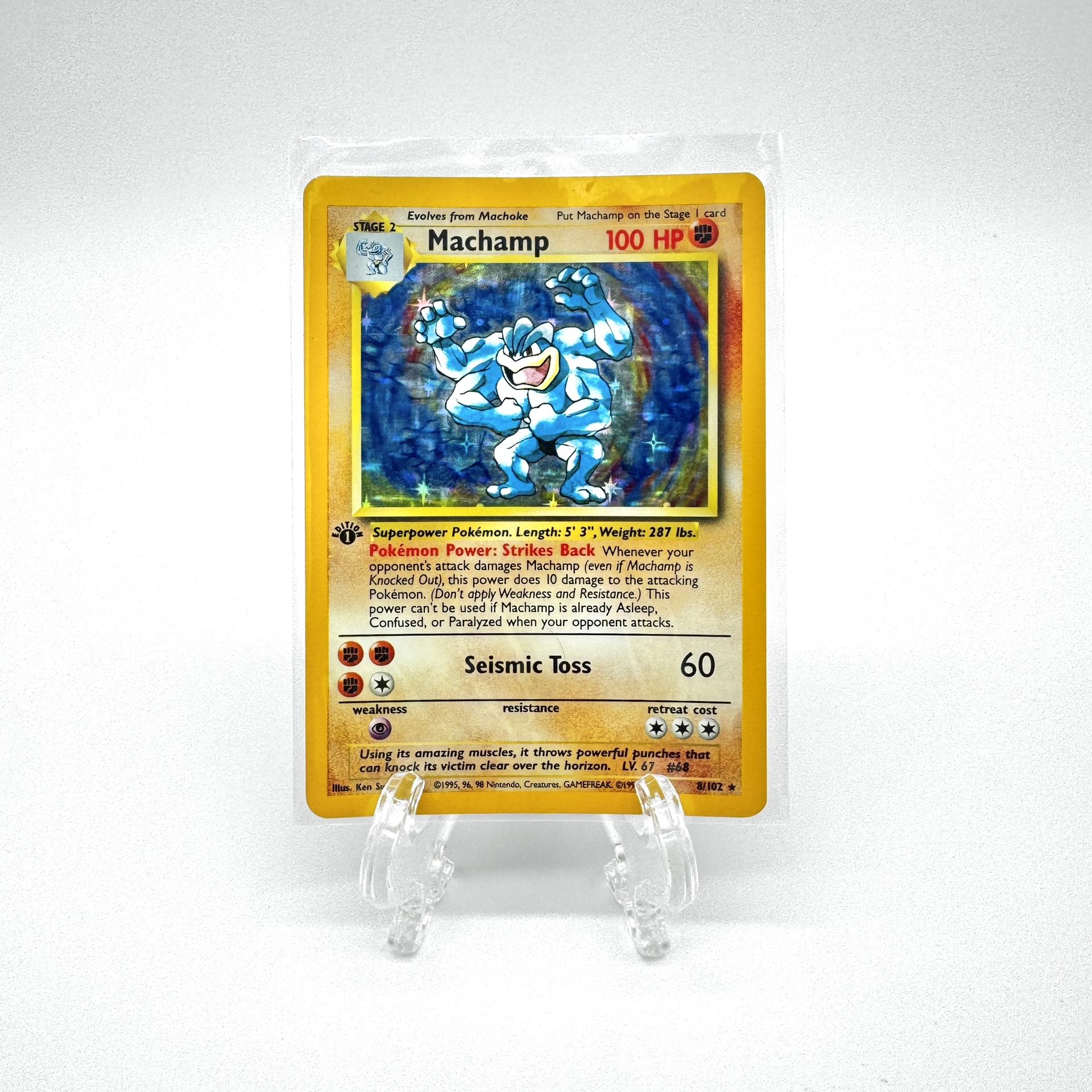 Machamp 8/102 1st Edition Rare Holo. LP to NM.
