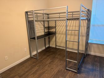 Full size loft bed with a desk