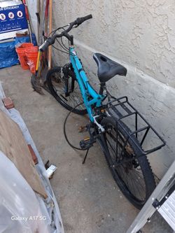 Teal Mountain Bike with Front Cargo Rack