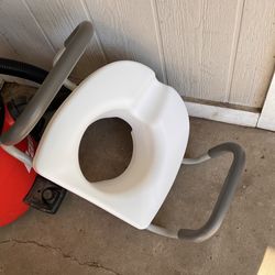 Raised toilet seat