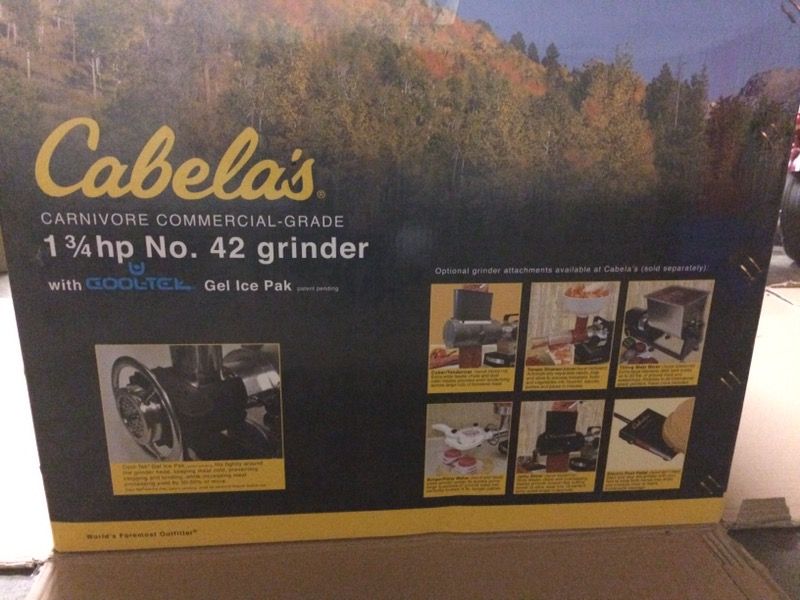 Cabela's carnivore 1.75 hp meat grinder plus extra blades and plates.