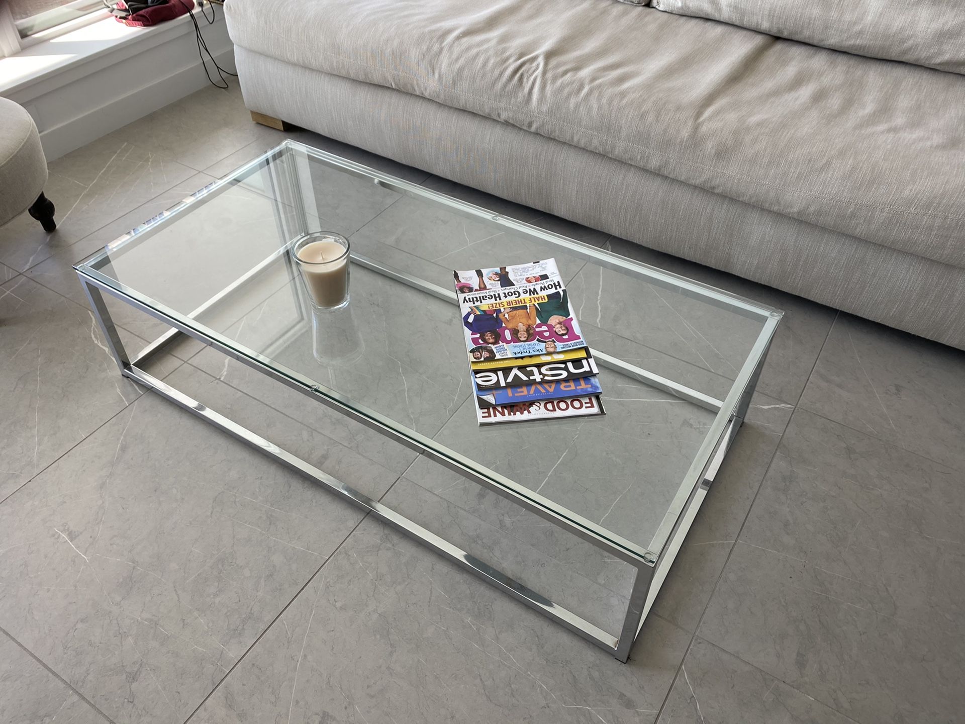 CB2 chrome and glass coffee table