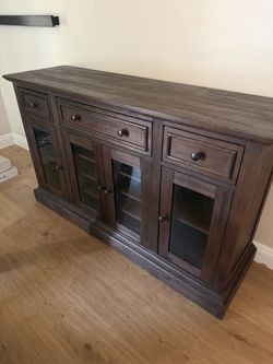 Brown wood dining room cabinet or side board