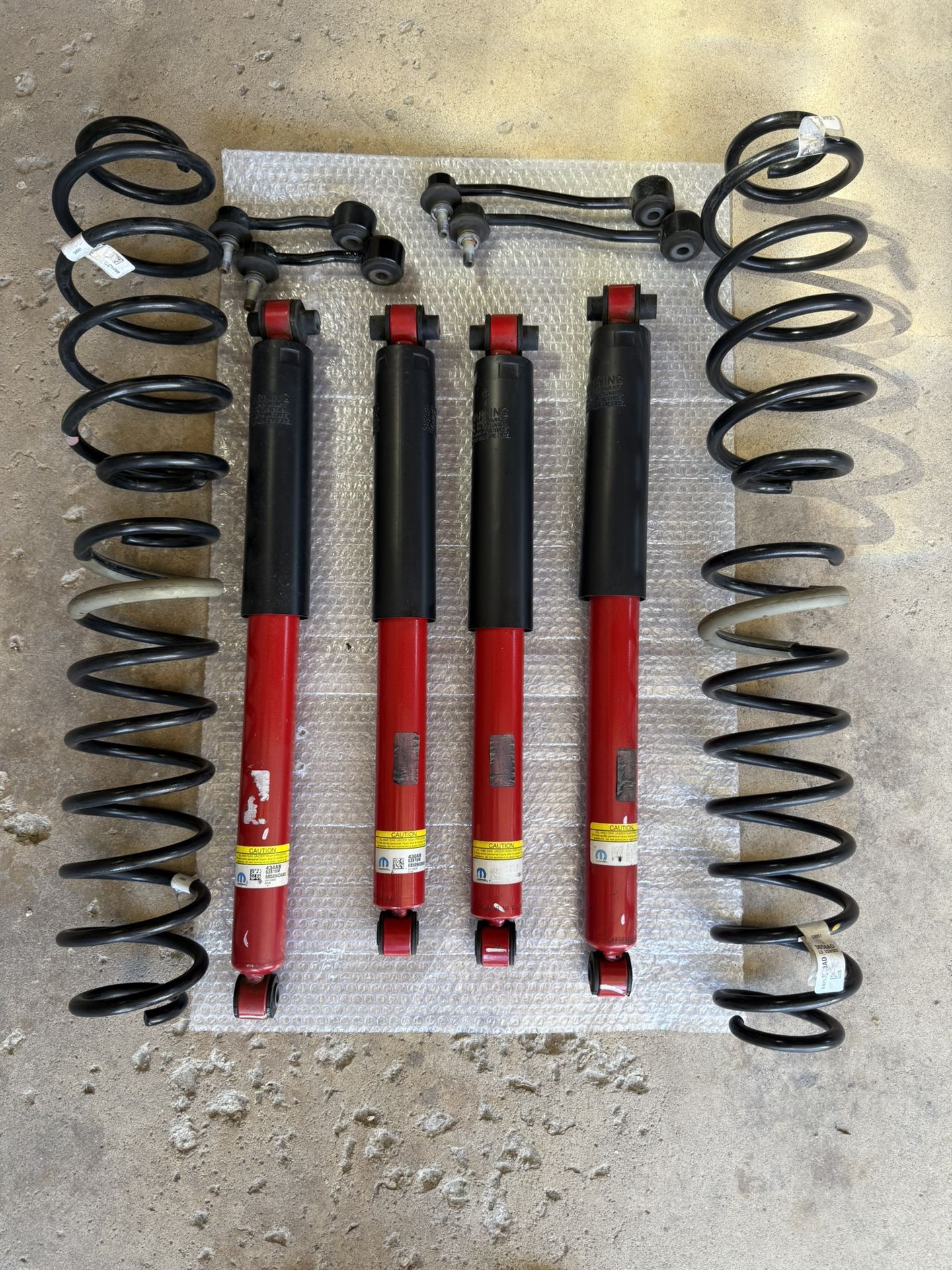OEM Mopar Shocks and springs.