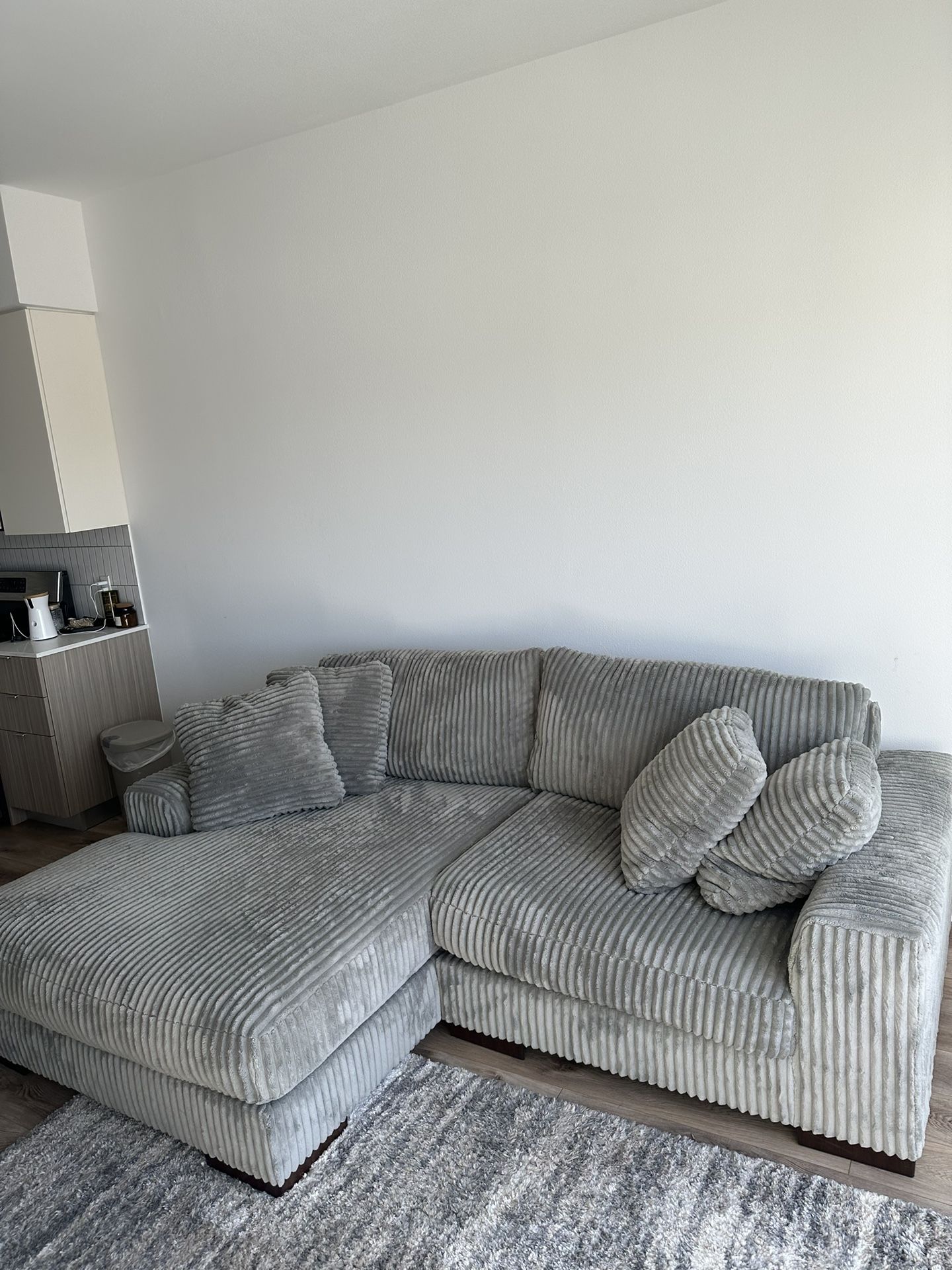 Ashley Furniture Plush Sofa and Beautiful 5x7 Matching Rug