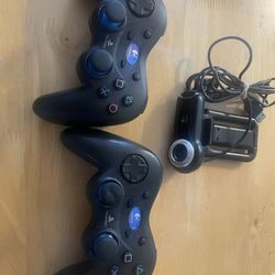 Three PlayStation three controllers