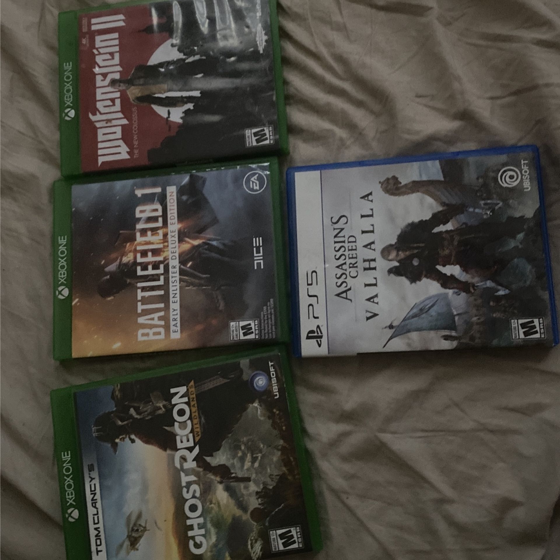 Three Used Xbox One Games And One Fairly New Ps5 Game