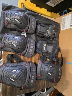 protective gear, including knee pads, elbow pads, and wrist guards.