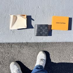 Louis Vuitton black monogram wallet.