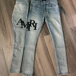 Amiri staggered indigo logo denim jeans