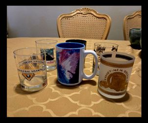6 Vintage Collectible Vacation Glasses and Mug.. 4 from Florida, 1 from Las Vegas, 1 from South Dakota. MGM, Universal Studios, Epcot, Sea World, Sout