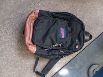 JanSport Black Backpack with Leather Bottom