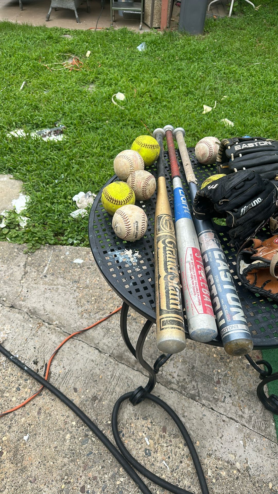 Softball Bats And 4 Gloves