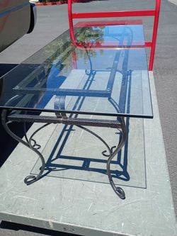 COFFEE TABLE HEAVY GLASS ELONGATED TOP $65
