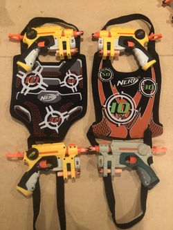 Four Nerf Guns And Four Velcro Chest Rigs