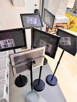 Selling 6 Metal Poster stands. All total $80 Adjustable height. Frames size 8.5x11” all new.