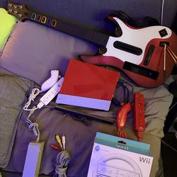 Red Nintendo Wii guitar hero set