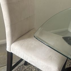 Tall Table With Glass And 2 Beige Barstools 