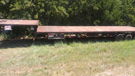 2001 Take3- 53 foot goose neck dove tail trailer with heavey duty winch and heavy duty ramps.