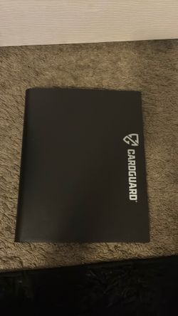 binder filled with cards football baseball and basketball
