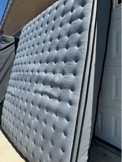 Complete bed Calif king with Good mattress and Iron frame