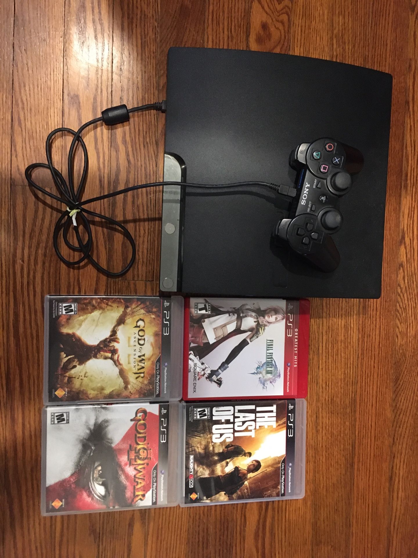 PS3 with 4 games and 2 controllers