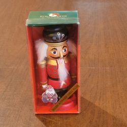 Vintage Kurt S Adler Wooden Candle Stick Nutcracker Santa's World Red 
Uniform New, in original box, sealed. Height 7". Weight 8oz plus 
shipping mate