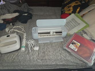 Cricut maker 3 with tools and vinyls and heat press