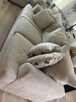Large Beige Fabric Sofa with Throw Pillows