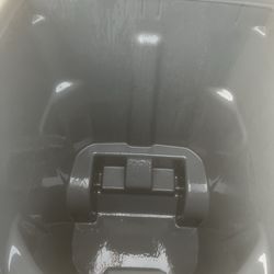 Pressure washing trash cans