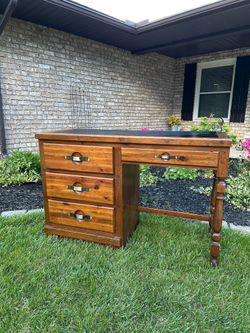 Solid pine wood vintage student desk with black laminate top and four drawers
