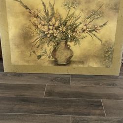 Hanging picture of vase with flowers